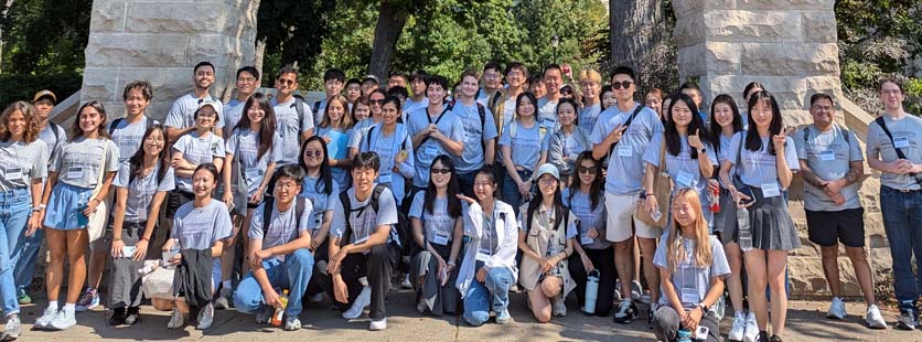 large group in front of Northwestern Arch