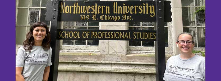 students in front of Wieboldt Hall sign